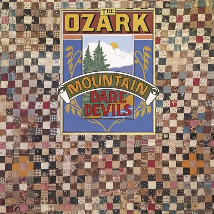 Logo of 'The Ozark Mountain Dare Devils' on a patchwork quilt background