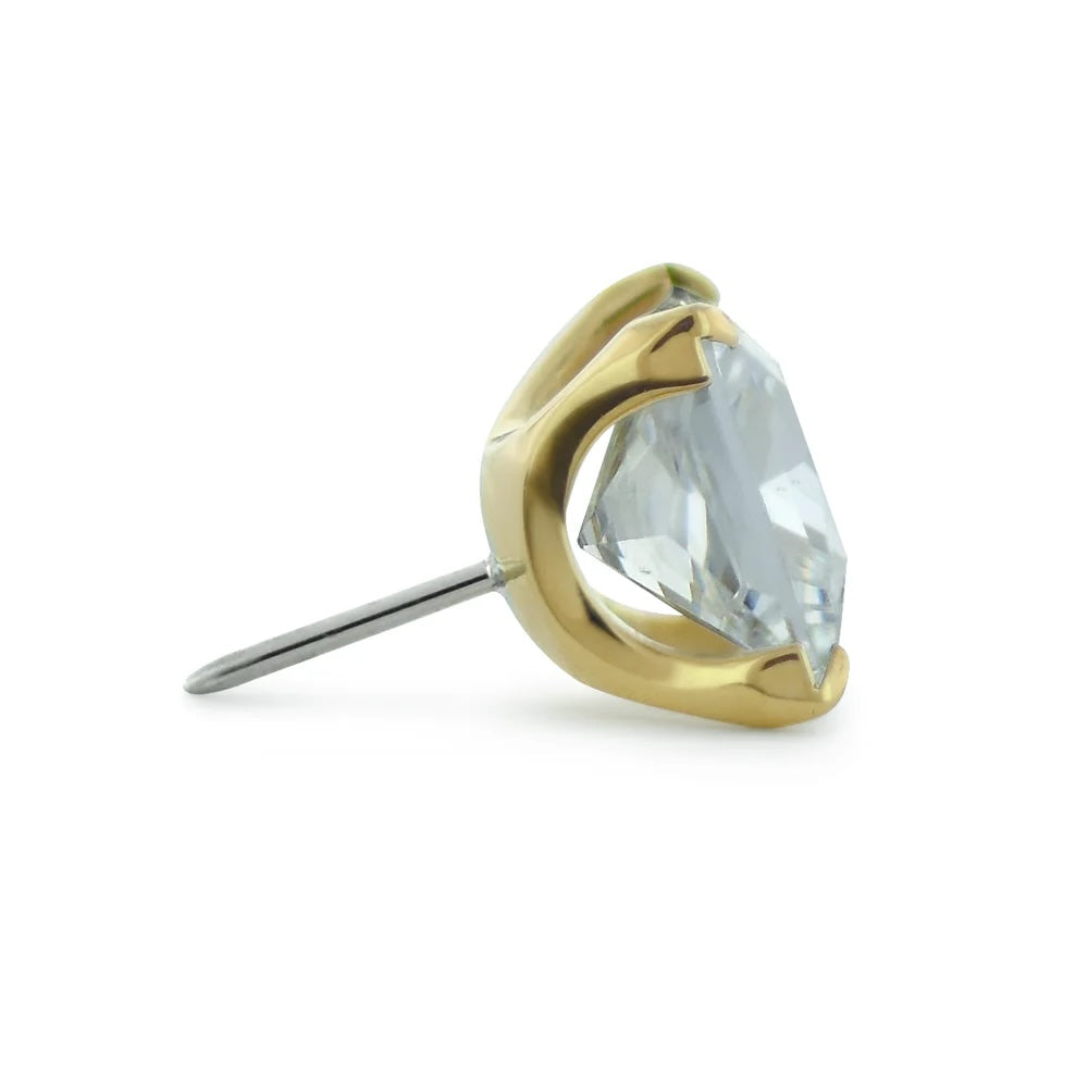 Gold earring with a clear gemstone on a white background