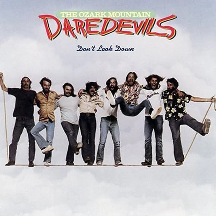Album cover for 'The Ozark Mountain Daredevils' with band members posing on a cloud.